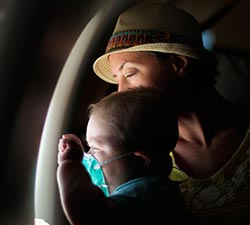 Young Patient and His Mom Aboard A Compassion Flight